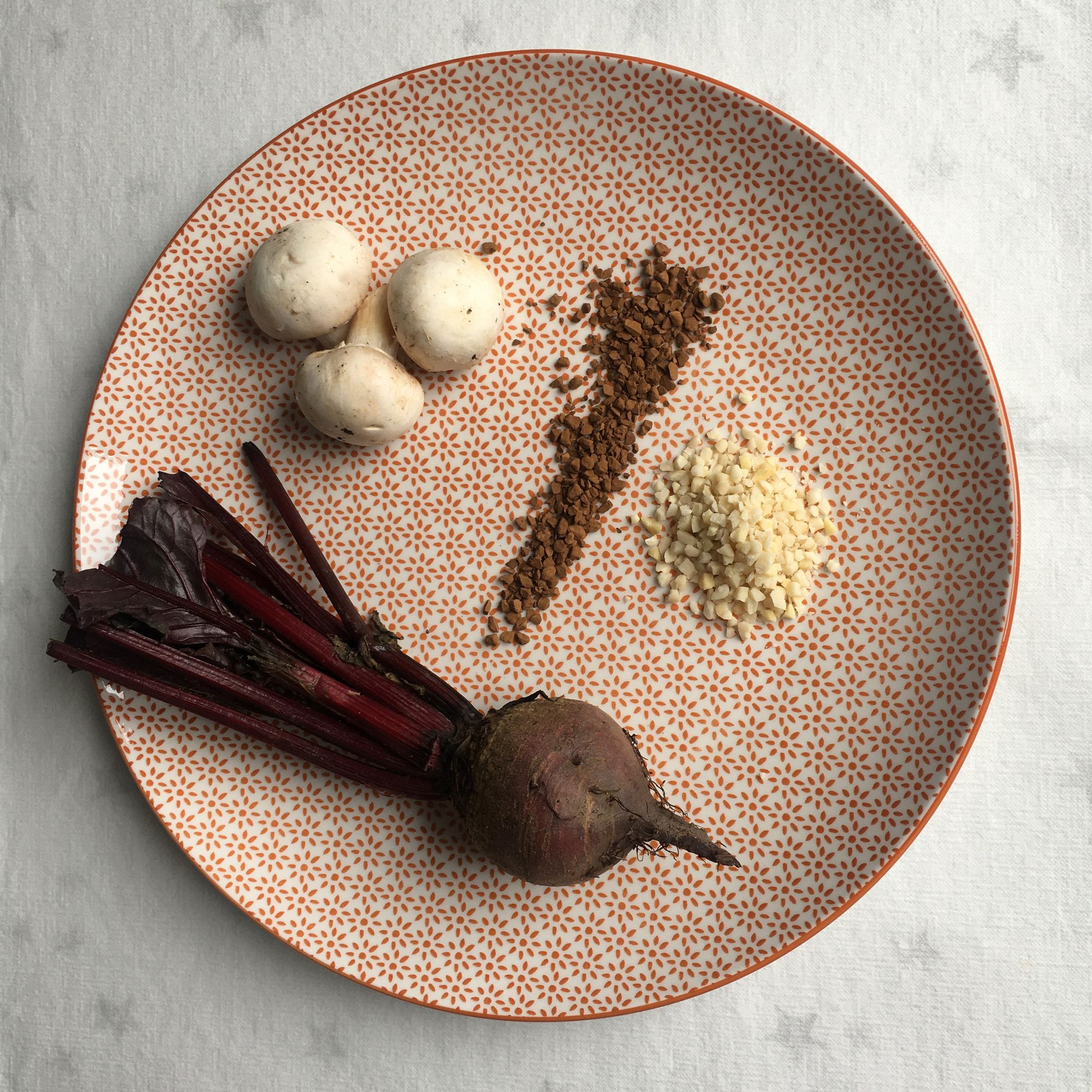 Plate with Tertiary Aroma objects - mushrooms, coffee, almonds, beet